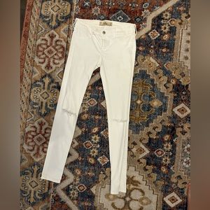 White jeans with busted knees